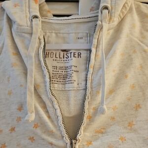 Hollister Light Gray Hoodie with Peach Stars